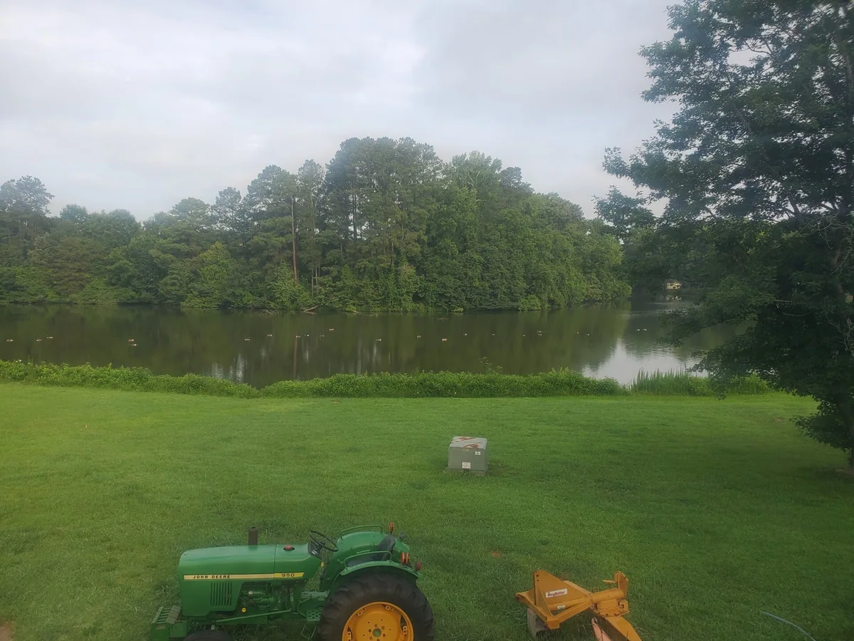 Green lawn, pond, and trees from Bahama Electric’s photo collection