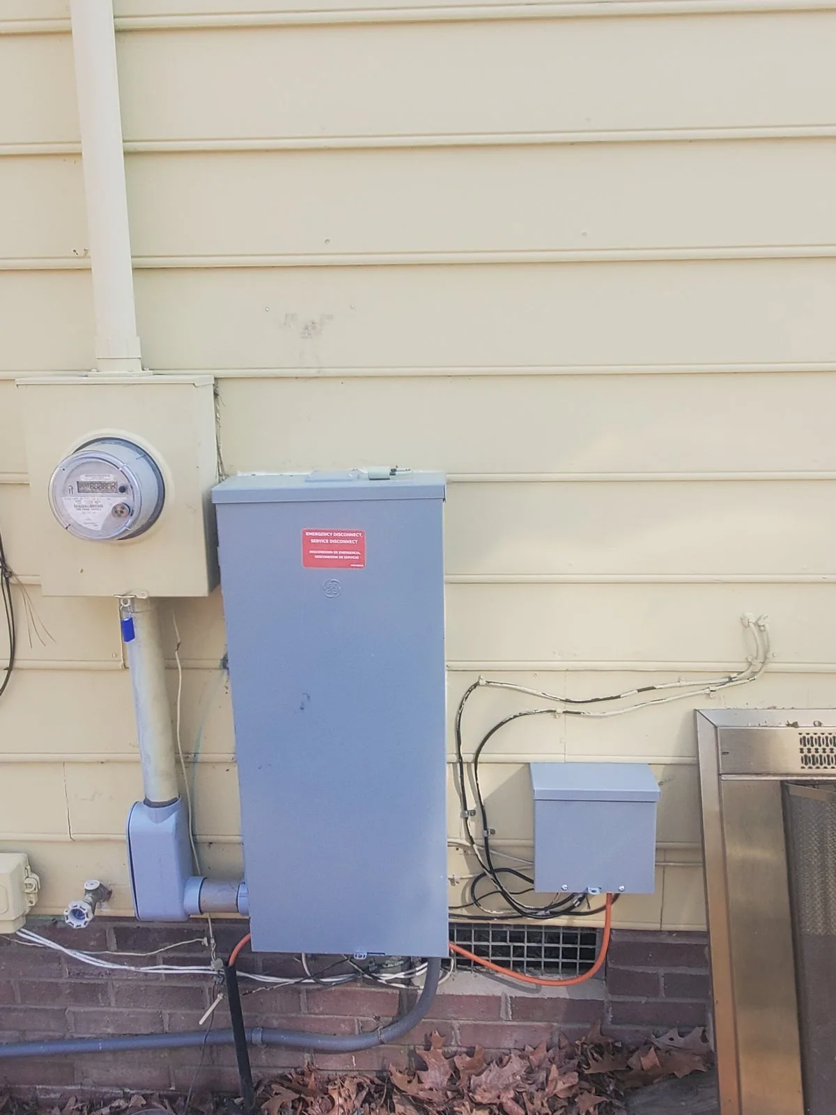 Electrical meter and service disconnect outside a home